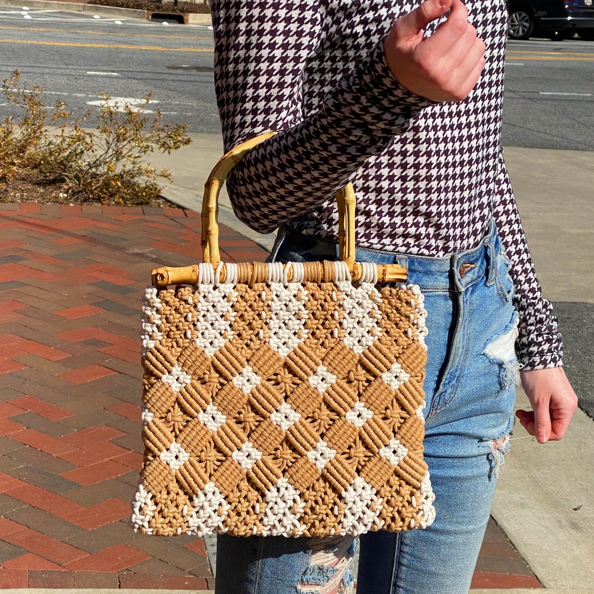 Purse has bamboo handles and durable woven material.