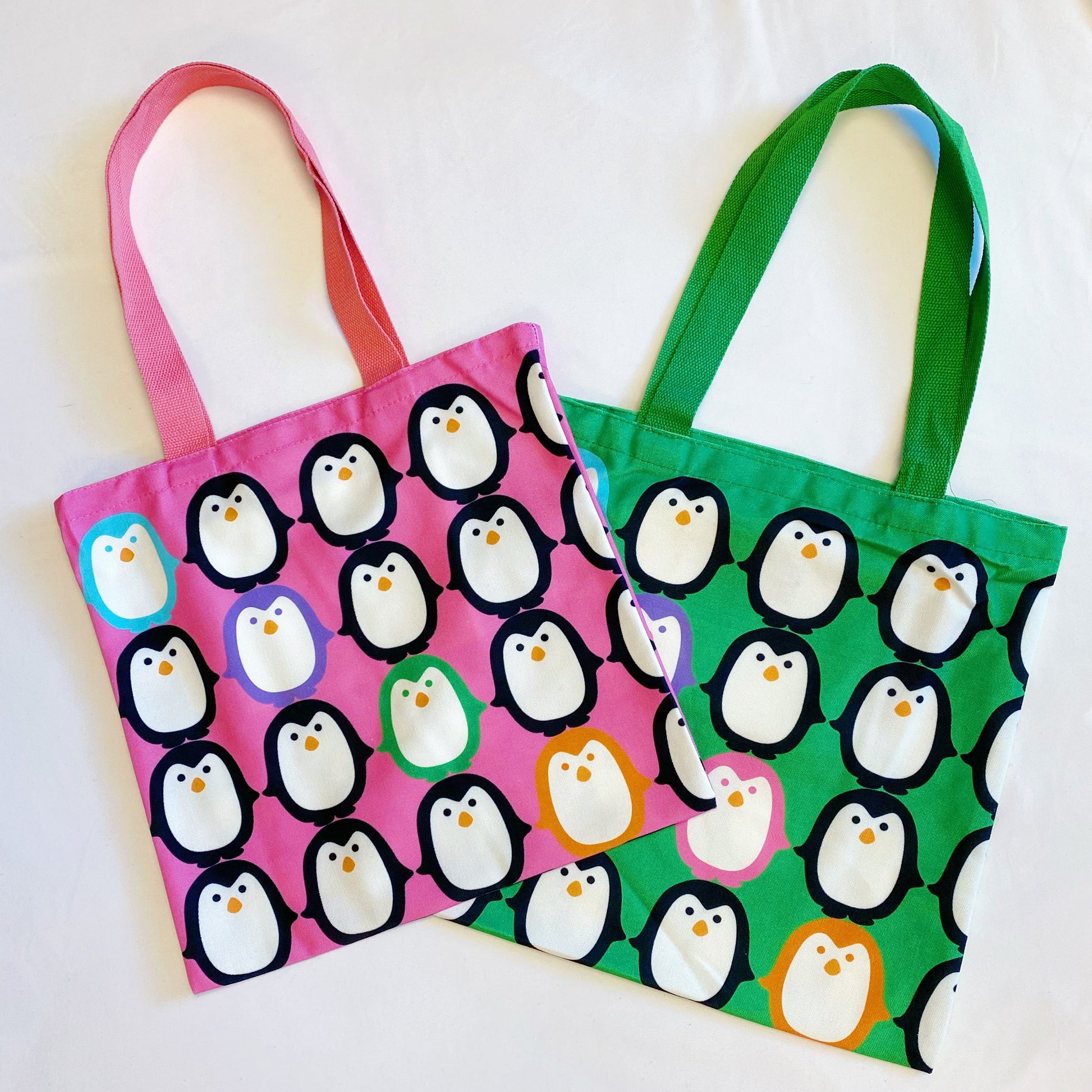 Reusable eco tote bag. Let's Hold Hands Penguin Canvas Tote.  Tote has an interior pocket for easy organization. 